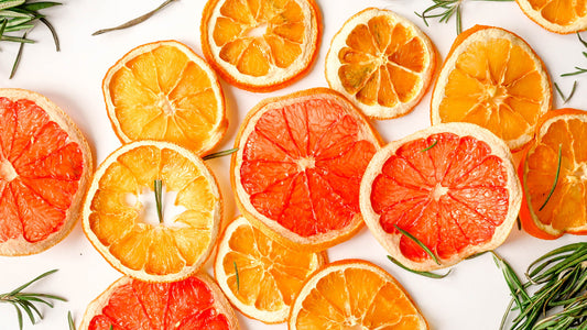 Citrus slices of various colors on a white background.